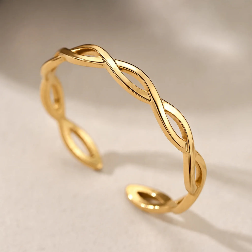 Velvane - Open Interlaced Band Ring With A Woven Look Add A Quiet Touch Of Shine To Everyday Outfits